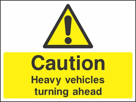 Caution Heavy vehicles turning ahead sign Caution Heavy vehicles turning ahead sign