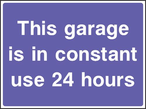 This garage is in constant use 24 hours Sign
