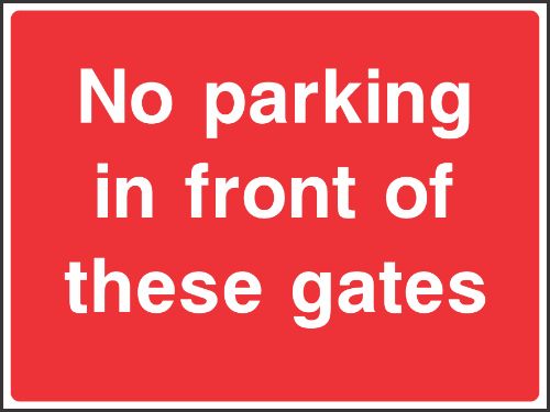 No parking in front of these gates Sign